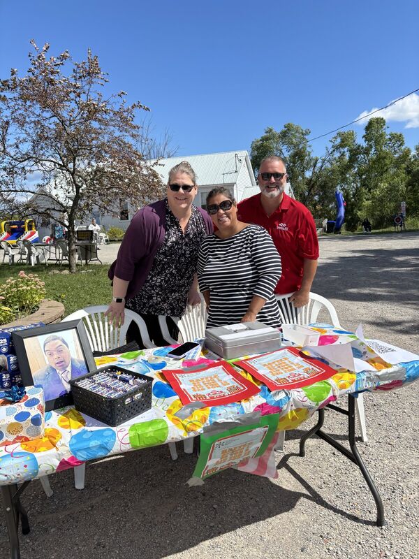 Fundraiser draw table with a colourful quilt