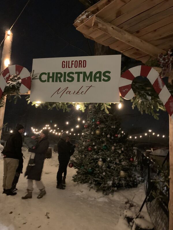 Gilford Christmas Market sign lit up at night