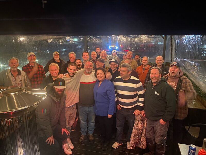 Large group of friends gathered at night