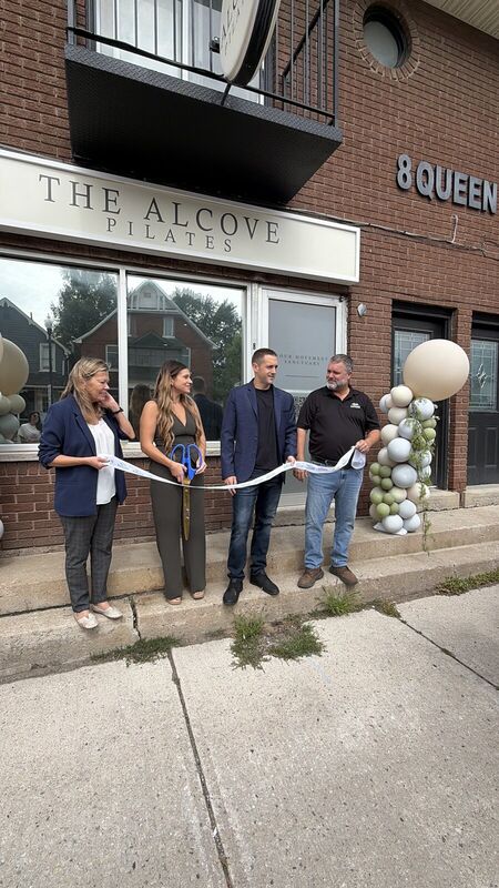 Ribbon cutting outside The Alcove on Queen Street